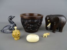 Carved African hardwood bowl and an elephant figurine, a Boma figure of a Canada goose, a 4cms