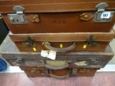 Four vintage leather and other suitcases