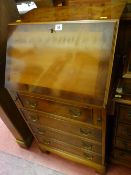 Yew wood four drawer compact writing bureau