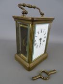 Vintage brass cased carriage clock with key