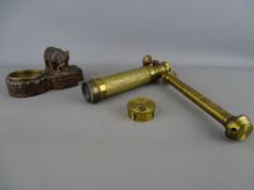 Three draw brass telescope on an adjustable mount and a Black Forest carved bear pin tray