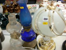 Modern table lamp and two glass and metal vintage oil lamps