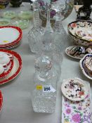 Group of five cut and other glass decanters with stoppers