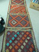 Suzni Kelim carpet runner, multi-coloured in four repeating block patterns with sectional borders,