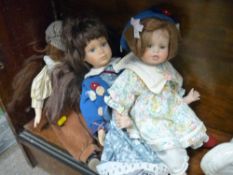 Three porcelain headed dolls