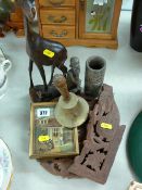 Folding carved hardwood table, two treen figures and a vase etc