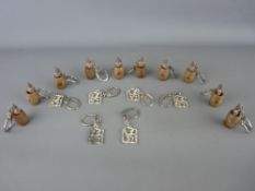 Collection of vintage keyring fobs in two patterns having risque mechanical actions