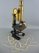 W Watson & Sons Ltd, London monocular microscope no. 24652, stamped 'R B G Q' with a long single