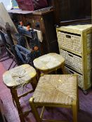 Chest of three woven storage baskets, two matching stools and another square stool