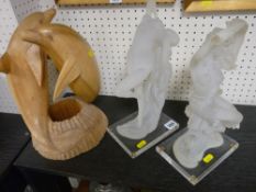 Pair of frosted glass figurines and a similar sized carved wooden dolphin