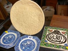 Persian type hand painted tile, two Willow pattern side plates and an Oriental ivorine relief