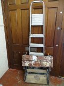 Metal stepladder and a black workmate bench