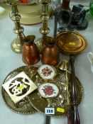 Pair of Victorian circular based brass candlesticks, two repousse brass wall plaques etc