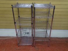 Pair of chrome finished four shelf storage racks