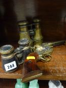 Pair of naval binoculars, opera glasses and a decorative Colt 45 pistol