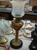 Victorian brass column lamp with copper and brass font and Aladdin model 12 wick adjuster