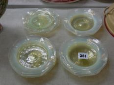 Fifteen vaseline glass side plates with polished pontils