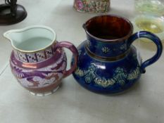 Doulton Lambeth jug and a Grays pottery lustre jug with dragon decoration