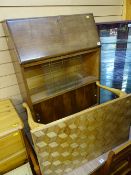 Slim bureau bookcase with glazed sliding doors and a small light wood coffee table
