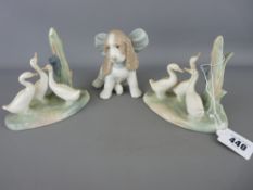 Two Nao porcelain groups of ducks and a seated spaniel with a big bow