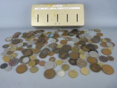Collection of vintage British and overseas coinage in a tinplate thrift box