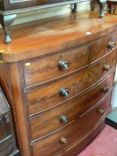 Mahogany bow front chest of two short over three long drawers with turned knobs