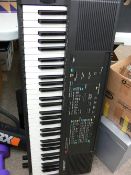 Kawai MK10 portable keyboard on stand and a small LG flatscreen TV