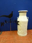 White painted metal milk churn and a black finished weather vane
