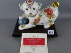Yuki Morioka porcelain figurine titled 'The Imperial Puppy of Satsuma' on an associated stand with