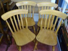 Set of four light wood farmhouse chairs