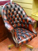 Modern faux leather button backed and studded office chair on castors