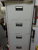 Light grey four drawer metal filing cabinet