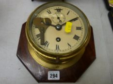 Ship's clock on a wooden plaque