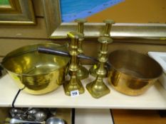 Iron handled brass jam pan, a pair and two other brass candlesticks and another brass pan