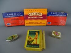 Small collection of card games and advertising playing cards with two white metal pill boxes