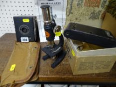 6-20 Brownie Jnr boxed camera, similar era camera in a case and a small microscope