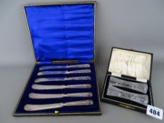 Cased set of six table knives with hallmarked silver handles and a cased pair of cut glass knife