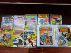 Parcel and folder of vintage DC action comics - 'Superman', 'Tomohawk' etc
