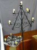 Wrought iron candle form standard lamp and a similarly styled ceiling light