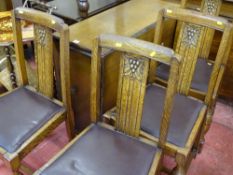 Oak drop leaf dining table with cupboard storage and a set of four rexine upholstered dining chairs