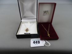 Nine carat gold cross and a pendant with amethyst type setting both on fine link chains