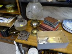 Two vintage oil lamps, one with an etched shade, small parcel of flatware and a parcel of vintage