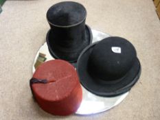 Bowler hat, a fez and a top hat by Best Quality of London and a vintage wall mirror