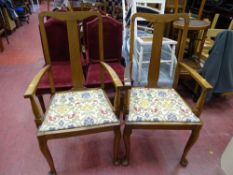 Pair of oak splatback elbow dining chairs with floral upholstery