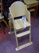 Modern light wood child's highchair