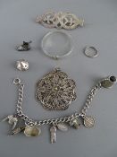 Silver charm bracelet, a filigree pendant, a child's silver bangle etc