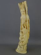 Meiji period Japanese carved ivory Okimono of a tall bearded Sage with a young boy at his feet