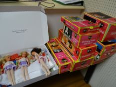 Three vintage Sindy dolls - al O33O55X and a good quantity of boxed accessories and loose clothing