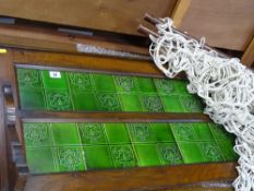Attractive tiled back of a washstand and a hammock