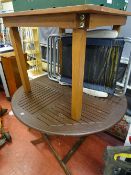 Two wooden garden tables and two garden recliners